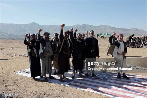 Yemen's Houthi followers shout slogans as they attend a tribal rally ...