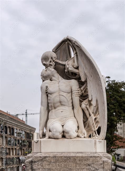 The Kiss of Death statue in Poblenou Cemetery in Barcelona. This marble sculpture depicts death ...