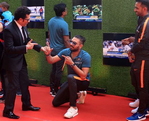 Sachin Tendulkar poses with his coach, Ramakant Achrekar, at the screening of his biopic ...