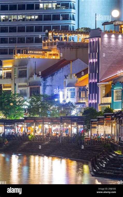 A night view of the Boat Quay on the Singapore River in Singapore. The ...