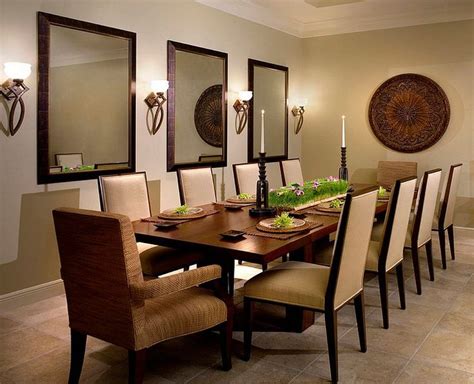 a dining room table with chairs and plates on it in front of two wall ...