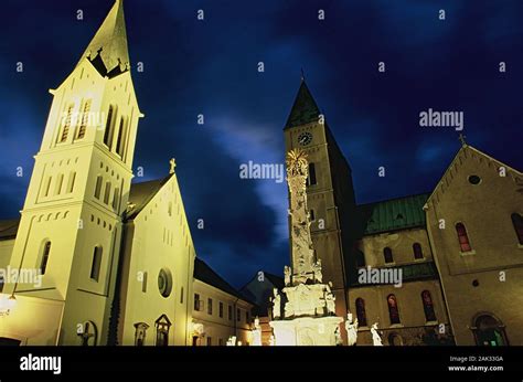 In front of the Franciscan church and St. Michael's Cathedral in Veszprem, Hungary, stands the ...