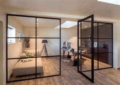 Crittall style fixed glass partitions with a pivot door in the middle | Glazen wanden ...