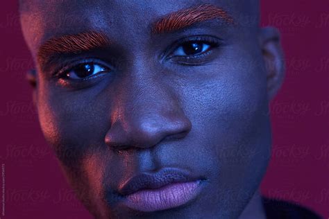 «African American Man Colourful Portrait Make-Up Blue Light» del colaborador de Stocksy ...