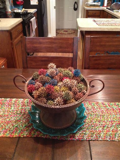 Sweet gum balls spray painted multi colored and used as a centerpiece | Primitive crafts, Sweet ...