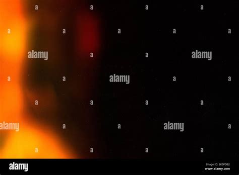 colorful warm rainbow light leaks on black background with dust texture Stock Photo - Alamy