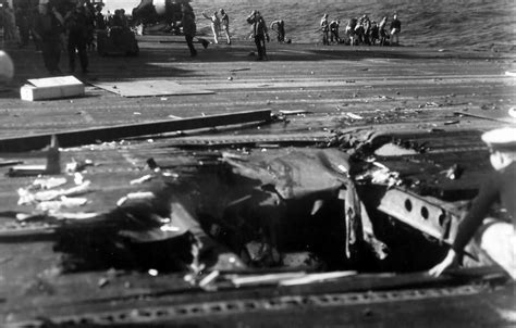 Hole in deck of USS Ticonderoga after Kamikaze attack off Formosa ...