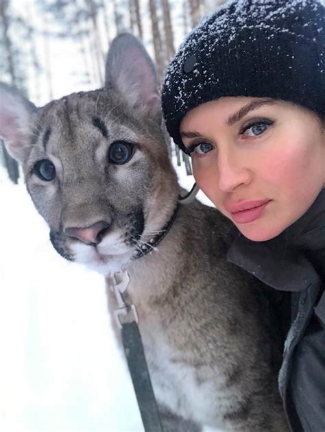 Russian Woman Keeps a Huge Puma as a Pet Along With Her Tiny Dog ...