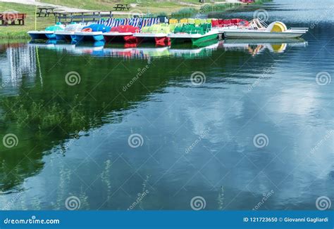 Colorful Pedalos on a Mountain Lake with Reflections Stock Photo ...