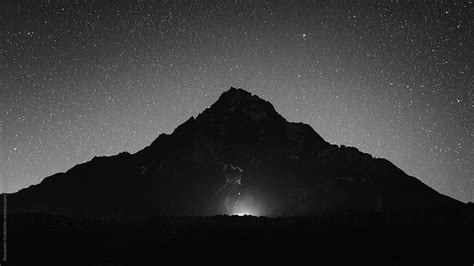 "Black Mountain In Night At Starry Sky" by Stocksy Contributor "Alexander Grabchilev" - Stocksy