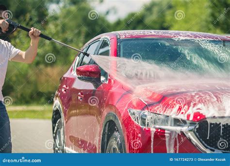 Manual Car Wash with Pressurized Water in Car Wash Outside. Summer Car ...