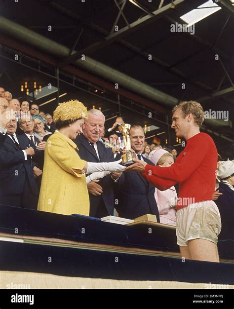 World Cup Final 1966. Queen Elizabeth II presenting the World Cup trophy (Jules Rimet Trophy) to ...