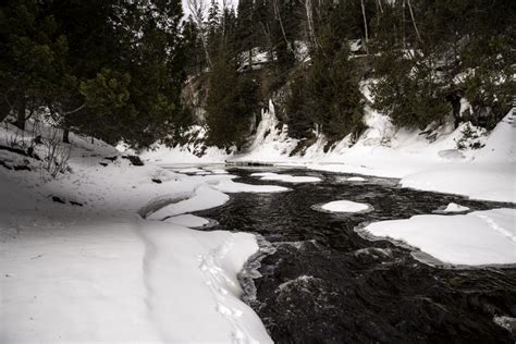 Flowing Cascade River in the winter at Cascade River State Park, Minnesota image - Free stock ...