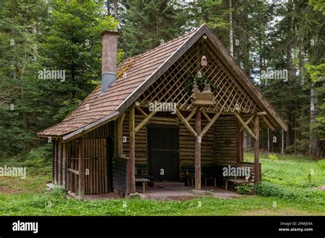 Picturesque old wooden hut in the forest Stock Photo - Alamy