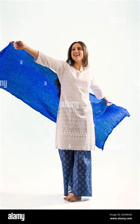 A woman in ethnic wear dancing with her chunni Stock Photo - Alamy