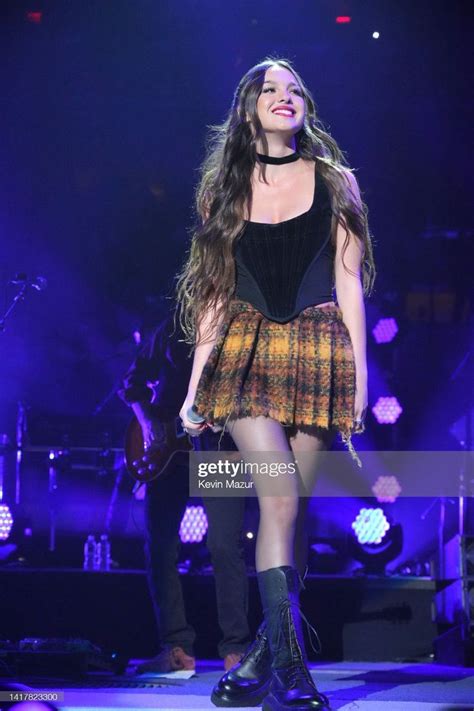 a woman standing on top of a stage