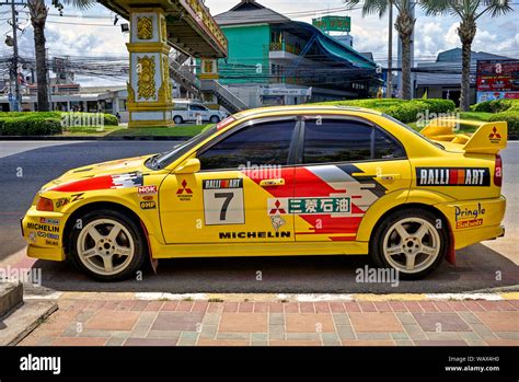 Mitsubishi Lancer yellow car. Race prepared modified sports saloon Stock Photo - Alamy