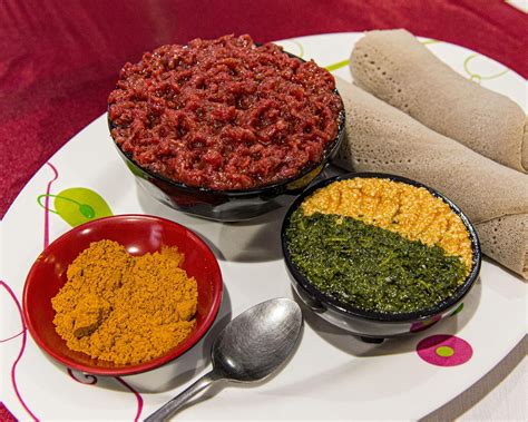 Ethiopian Kitfo - spice-marinated raw beef with extra spice, sides, and injera bread rolls : r ...