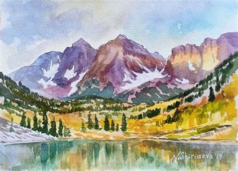 a watercolor painting of mountains and trees on a lake with the sky in ...