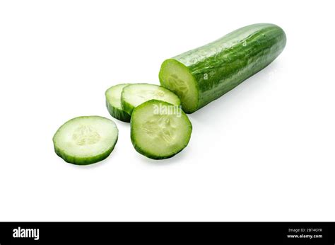 Cucumber and slices isolated over white background Stock Photo - Alamy