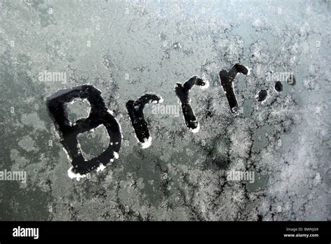 "Brrr..." (the sound of shivering) written onto frost/frosted car window.Depicting feeling cold ...