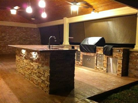Outdoor kitchen with stone and wood finish | Beautiful new o… | Flickr