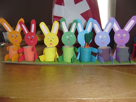 some paper rabbits are sitting in front of a flag