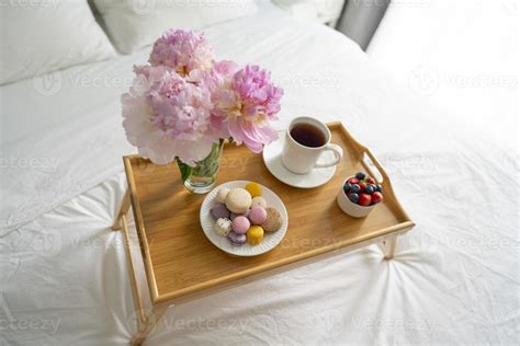 Tray with breakfast on bed. 16070898 Stock Photo at Vecteezy