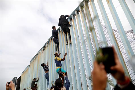 Migrants from caravan in limbo as U.S. says border crossing full