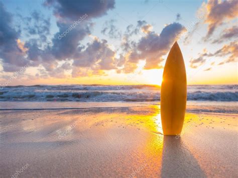 Surfboards On The Beach At Sunset