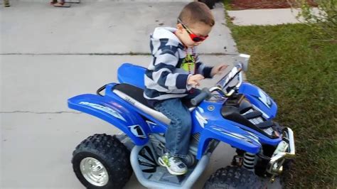 Riding Yamaha Raptor TOY 4 wheeler POWER WHEELS - YouTube