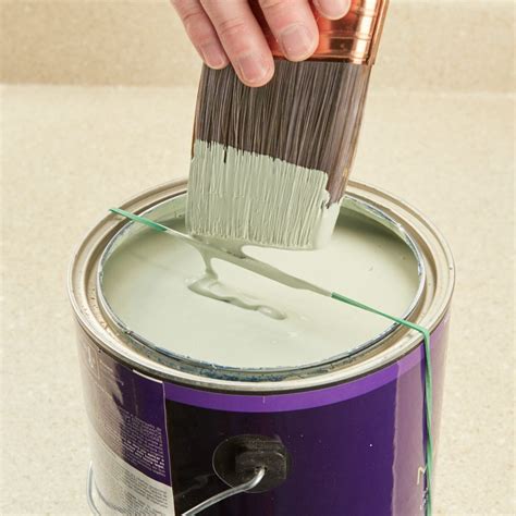 Rubber Band Paint Can Accessory — Tip from The Family Handyman