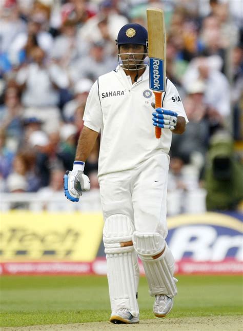 MS Dhoni raises his bat after getting to his half-century ...