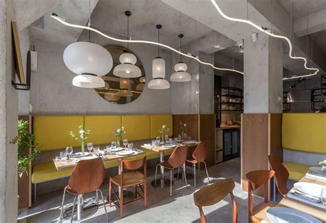 Bright Yellow Bistro Decor by Bogdan Ciocodeica - InteriorZine