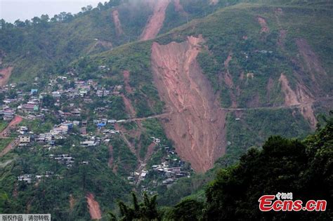 Dozens buried in landslides in Philippines after tropical storm