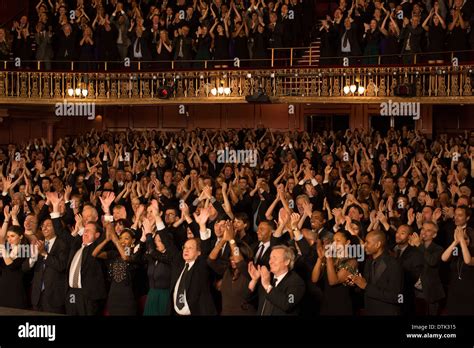 Audience cheering in theater Stock Photo - Alamy