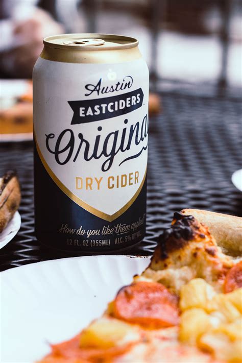 Austin Eastciders Dry Cider Can on Black Metal Table · Free Stock Photo