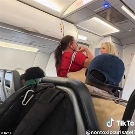 Outrageous moment woman on Frontier Airlines flight pulls down her ...