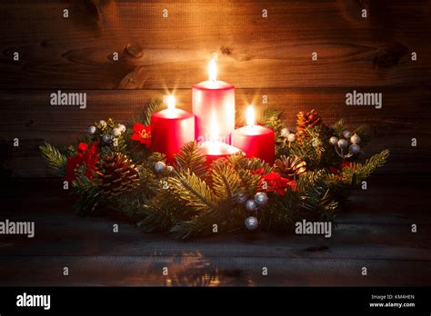 Fourth Advent - Decorated Advent wreath with four red burning candles ...