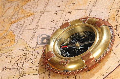 old-fashioned compass on an old map by dyoma Vectors & Illustrations Free download - Yayimages