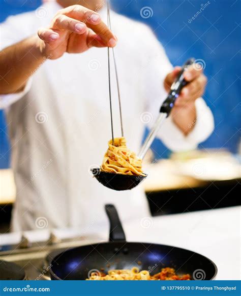 Chef Cooking Pasta, Chef Serves Spaghetti Carbonara on the Plate in the ...