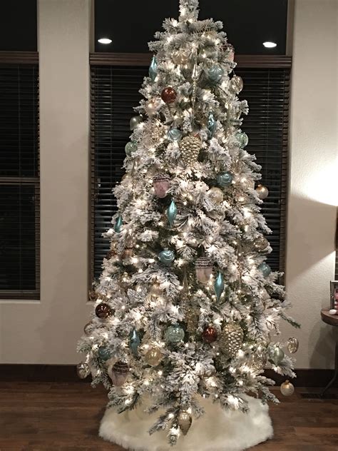 Festive Holiday Decor: 9ft Flocked Tree with Stunning Ornaments