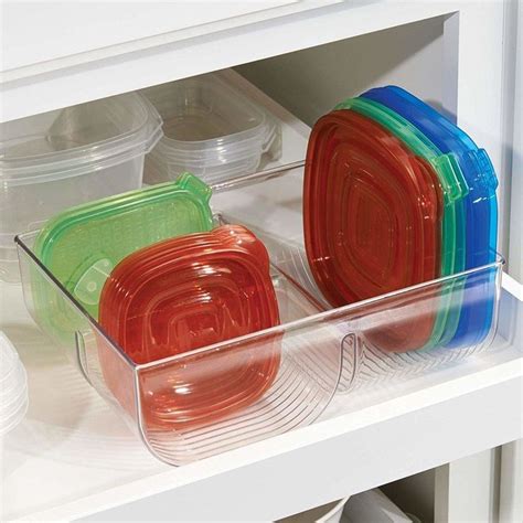 A set of two Tupperware lid organizers because it's time for the hellish landscape of "which lid ...