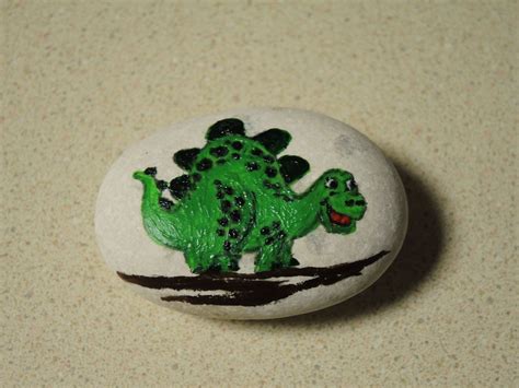 Pin by Anna on Dinosaur And Caveman Painted Rocks | Painted rocks, Rock painting art, Christmas rock