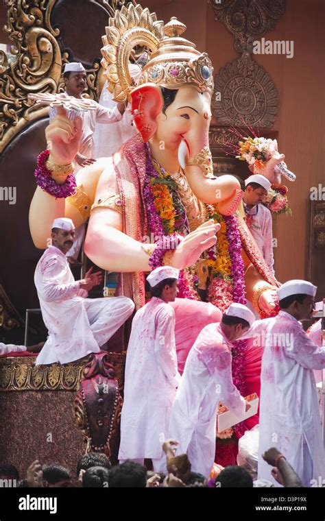 People at religious procession during Ganpati visarjan ceremony, Mumbai, Maharashtra, India ...