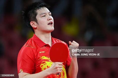 Fan Zhendong Table Tennis Player Photos and Premium High Res Pictures ...