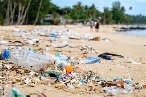 Beach pollution. Plastic bottles and other trash on the beach Stock ...