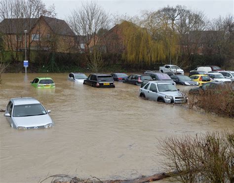 The River Welland burst its banks in Market Harborough, Leicestershire, and flooded a nearby car ...