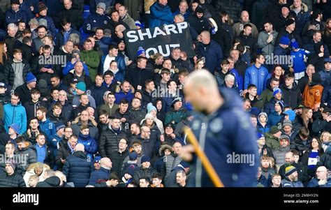 Everton fans hold up banners in protest against the clubs board ahead ...