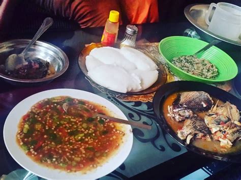 Cooking and eating traditional Zambian food. The main staple is nshima ...